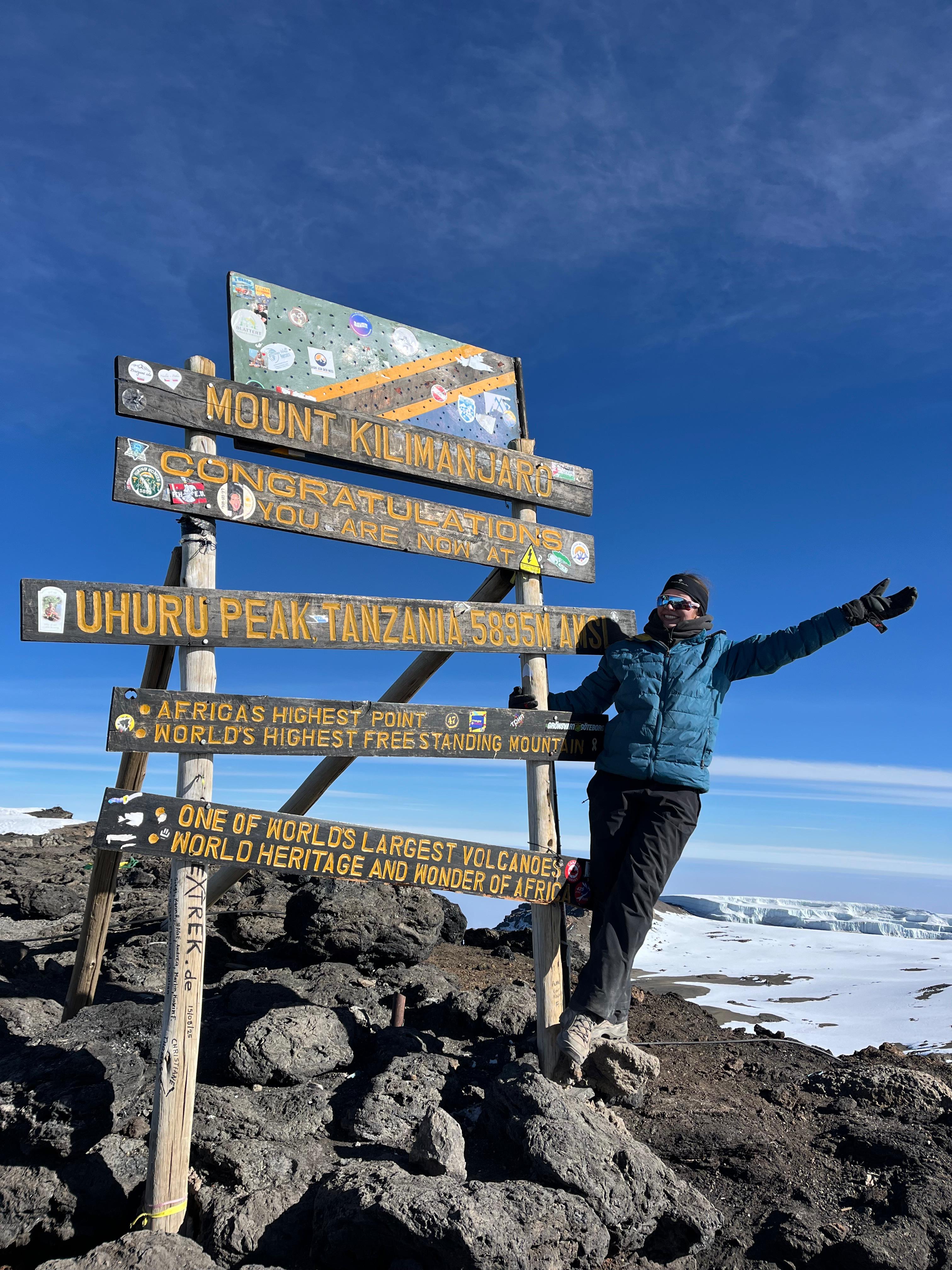 Charlotte at Uhuru Peak on Mount Kilimanjaro